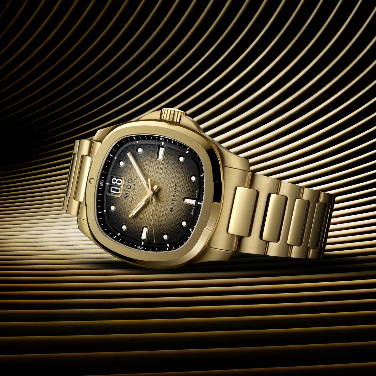 Mido Multifort TV Big Date oro giallo design